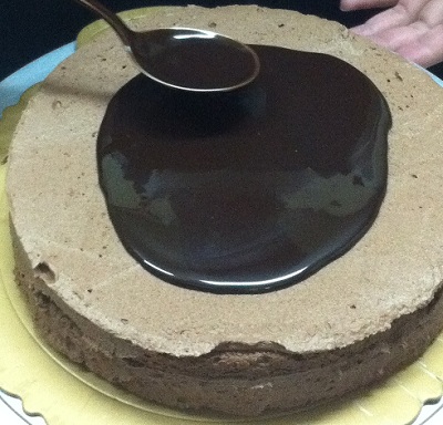 Pouring Liquid Chocolate On Sponge Cake